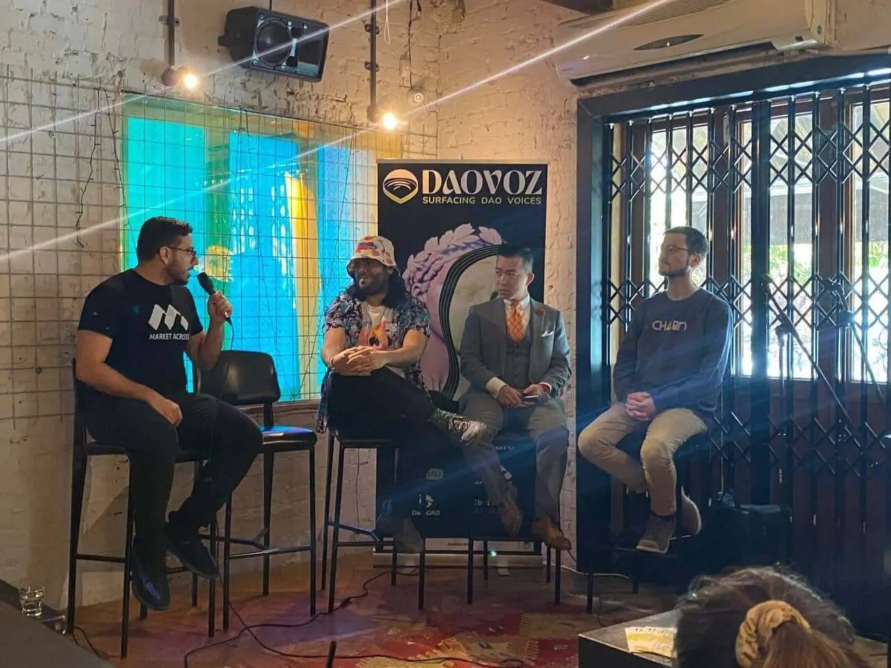 MarketAcross on stage at DAOVOZ with Safe, BitDAO, and DoinGud